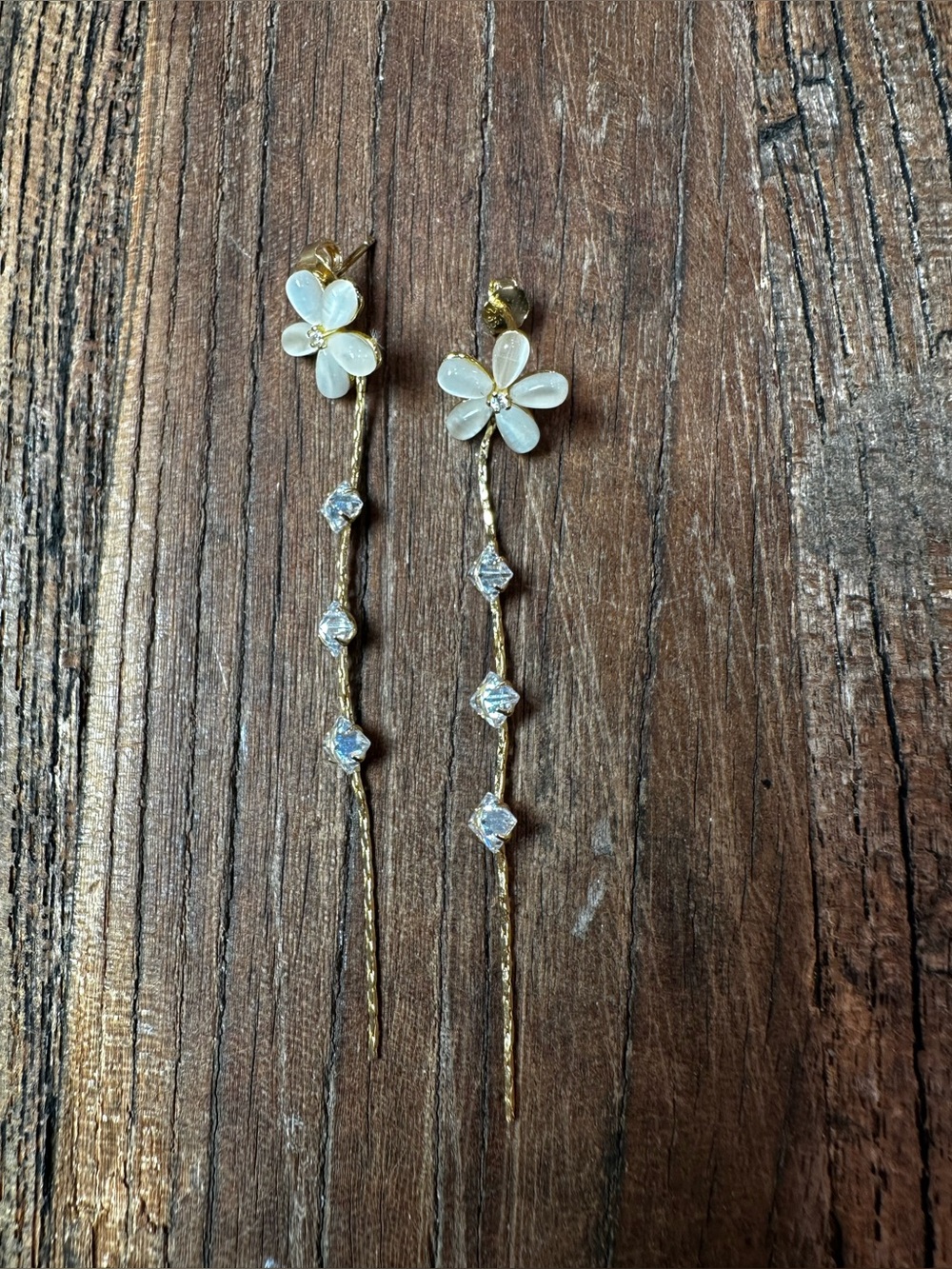 Gold Floral Drop Earrings with White Petal Accents